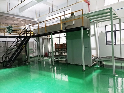 جهاز تفريغ العلب من المنصات وتحميلها على خط ناقل